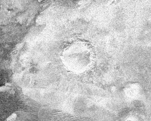 Cassini image of another crater on Titan. Image Credit: NASA/JPL.