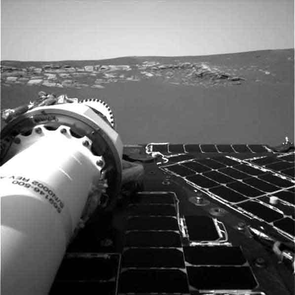 A picture of what appears to be bedrock peaking out from the sands of Mars.  Image credit NASA/JPL.