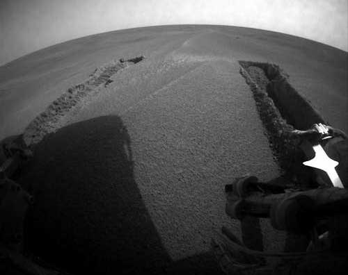 Opportunity - tracks left in the sand as Opportunity gets unstuck. Image credit NASA/JPL.